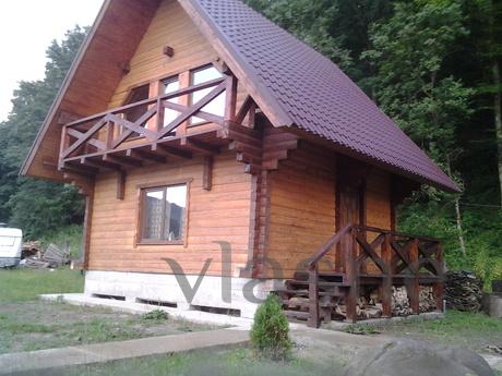 The wooden houses are located in the picturesque corner betw
