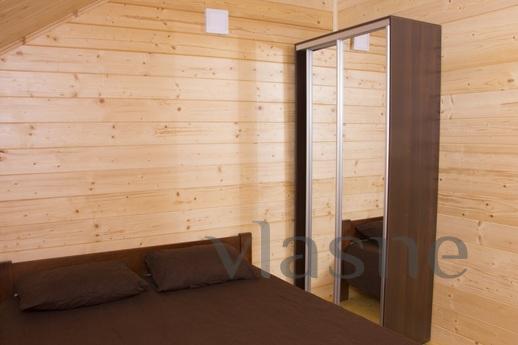 Modern two-storey cottage in Kblevo in a pine forest. To the
