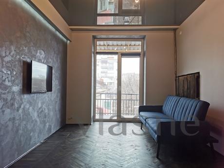 apartment in the very center of the city, while in a quiet l