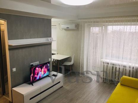 The apartment is in the city center, near the central square