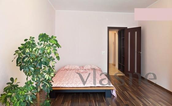 A cozy two-bedroom apartment in a new house is located in th