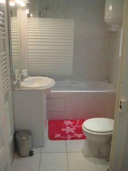 Studio apartment. The room - double bed, sofa, wardrobe and 